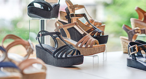 Black and tan ankle boots displayed together